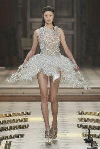 Iris van Herpen Seijaku couture creation inspired by cymatics and sound waves, with hand-blown glass bubbles coated in silicone forming bioluminescent patterns.
