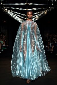 Iris van Herpen Syntopia collection dress inspired by bird flight and kinetic installations, crafted with laser-cut organza and intricate weaving.