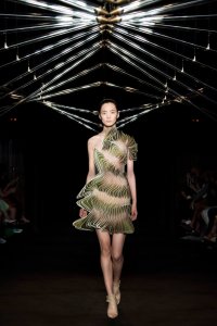Iris van Herpen Syntopia collection dress inspired by bird flight and kinetic installations, crafted with laser-cut organza and intricate weaving.